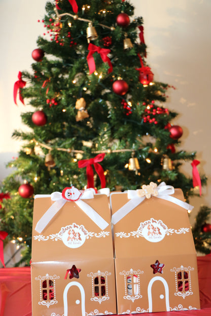 Gift boxes with decorative ribbons in front of a Christmas tree

